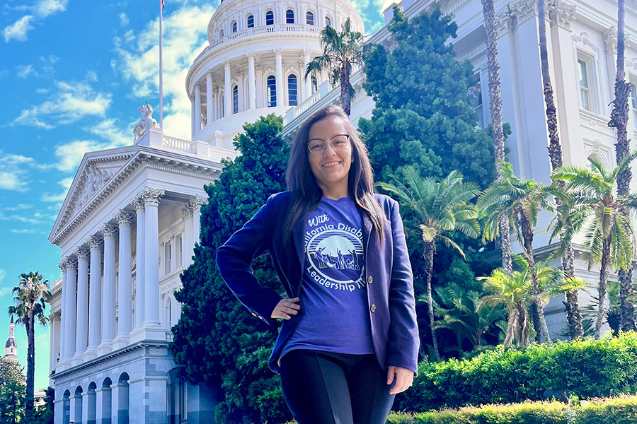 Marisol Rubio posing in front of a government building