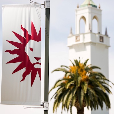 LMU spirit mark flag and chapel tower in the distance