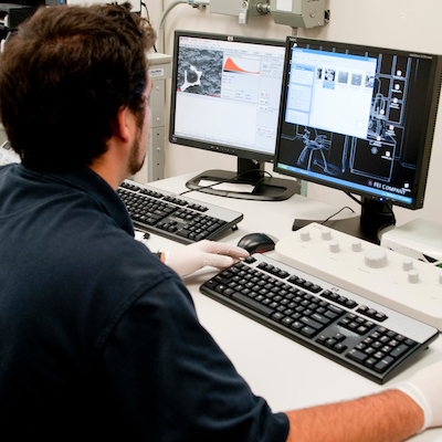 male working on computer in science lab